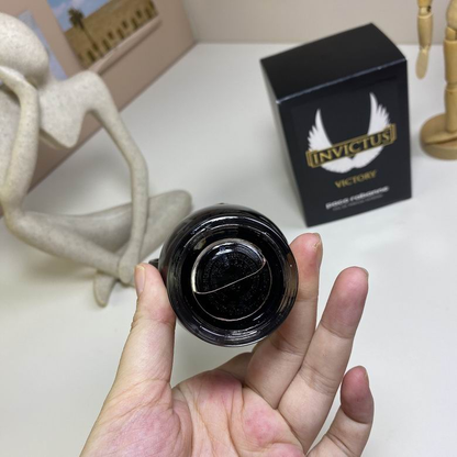 Paco Rabanne Invictus Victory all-black trophy bottle held in hand
